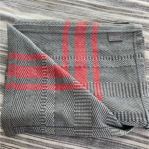 Coyuchi Gray and Orange Blanket with Woven Texture and Plaid Design